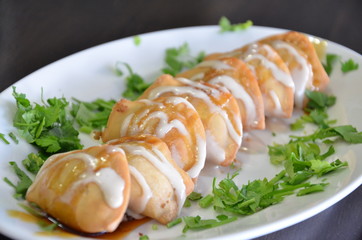 food on plate with green leaf