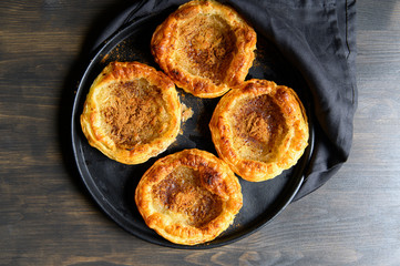 Puff pastry with coconut and cinnamon. Sweets.