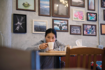 Asian girl drink coffee