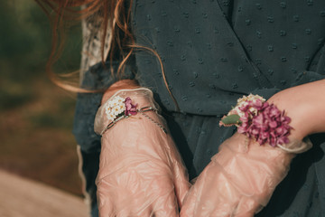 Stylish fashionable beautiful girl woman quarantined in spring with flowers and accessories