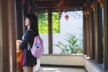 Beautiful girl in front of China In the garden