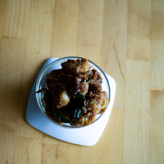Kuih Puteri Mandi served on a bowl. Made from glutinous rice flour, coconut, brown sugar, Gula Melaka or gula nisan.
