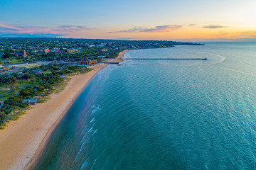 Aerial landscape of Frankston Yacht Club and the pier at sunset in Australia
