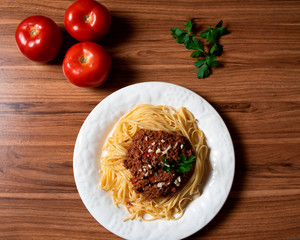 
Bolognese spaghetti in a porcelain plate with decoration