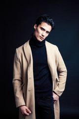 Obraz premium handsome asian fashion looking man posing in studio on black background, lifestyle modern people concept