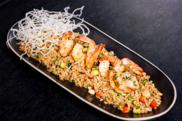 Fried rice with calamari - asian food. chaufa rice with shrimp
