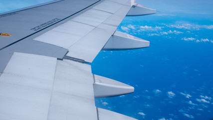 Fototapeta premium view from airplane window with airplane wing