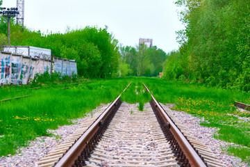Obraz premium abandoned railway tracks in an industrial zone color