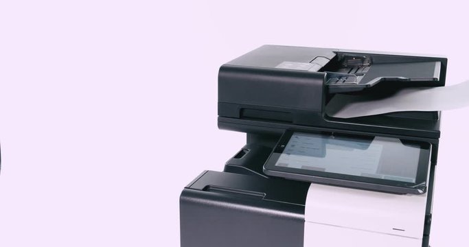 Hand pressing photocopier screen to start copying