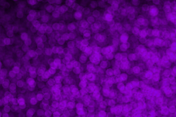 Magic violet illuminated lights. Glittering surface with glow effect. Bokeh defocused light for overlay effect.