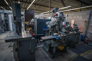 Fotobehang Machine shop featuring lathe, mill, and band saw for building and repairing things © Trevor Parker Photo