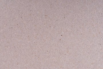 Beige carton plain surface. Grain paper Box for packing. Cardboard grunge recycled craft texture with fiber.