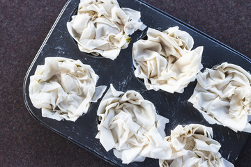 plant-based food, filo pastry cups with vegan filling before going in the oven