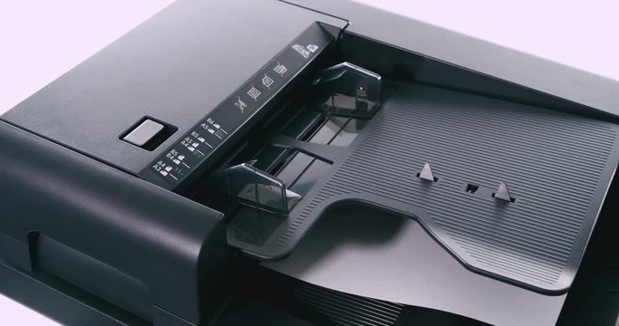 A4 paper entering the copier on white background