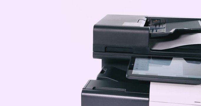 Paper going in and out of a copier