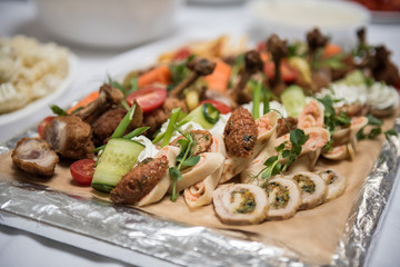 Assorted appetizer meat snacks with vegetables