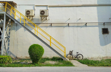 The yellow stair with the white wall.