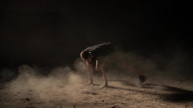 young teenager dancing breakdance hiphop in sunny environment