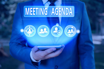Writing note showing Meeting Agenda. Business concept for An agenda sets clear expectations for what needs to a meeting