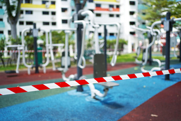 Fototapeta premium Editorial submission - COVID19 tape barriers surrounding exercise areas in Singapore