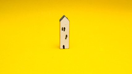 Home on yellow background  minimalistic concept