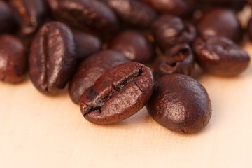 Dark roasted coffee beans  background  ,close up