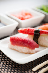 Unagi sushi in front of a nigiri plate