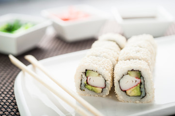 Uramaki sushi california sesame maki on a dish