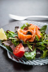 Salad with salmon, cherry tomatoes, lettuce