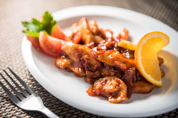 Chicken wok with carrots, onions and tomatoes