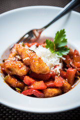 Fried spicy chicken with vegetables and cheese