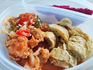 Sweet and sour shrimp, omelette and dragon fruit for lunch at the office