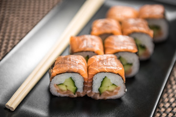 Sushi maki Sake kappa hosomaki with salmon and cucumber