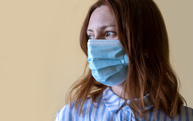 Portrait of young woman wearing face mask. Flu epidemic and virus protection concept.