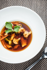 Red vegetable soup with carrots, broccoli