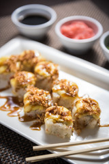 Hot sushi fritter maki with cooked salmon
