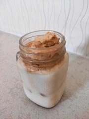 Milkshake with coffee and ice cream on a gray background