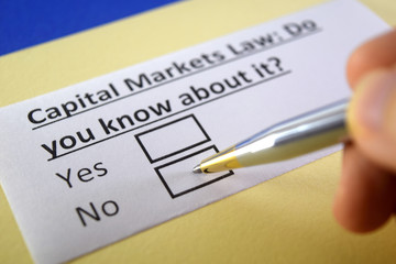 Fototapeta premium One person is answering question about capital markets law.