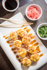 Hot sushi fritter maki with cooked salmon
