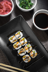 Sushi maki unagi hosomaki with eel, cucumber