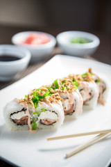 Sushi maki Kairo maki with cooked bacon, salmon
