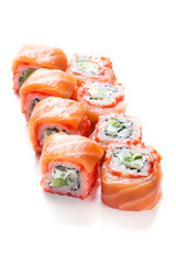 Sushi maki rolls with fresh salmon on top