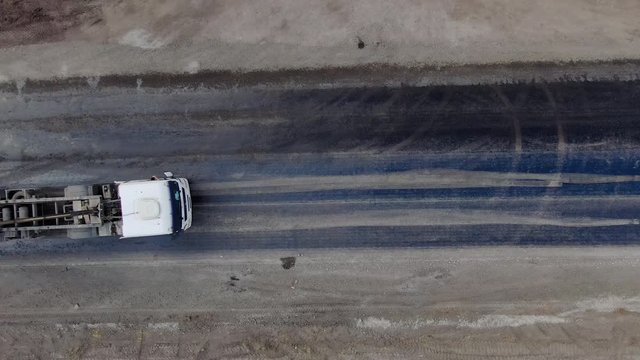 4K video. Top view of road works with asphalt paver.