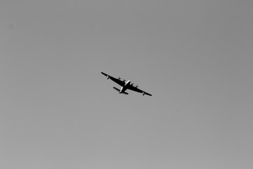 Fototapeta na wymiar Propeller Airplane/Aircraft spotted Near Malibu on the Pacific Coast Highway (California Highway 1). California, USA. Black & White Photo. 