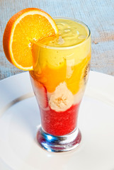 Closeup of fruit juice with fruits in glass
