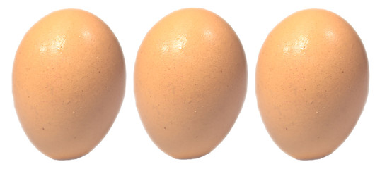 close up three bright brown chicken eggs isolated on white background . 
