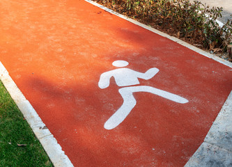 A person walking or walk sign