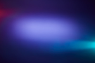 Cloud of light with red and light blue rays of light on a blue background