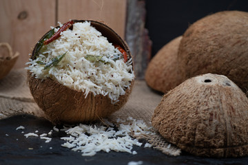 Coconut rice pilaf served in coconut shell