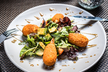 Stuffed Crab claws with fresh green lettuce